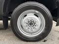A close-up view of a wheel from a 2018 Ford F-550 featuring a silver rim with multiple bolts and a black tire with tread pattern visible
