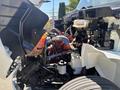 Close-up of a 2018 International DuraStar engine showing various components including hoses wires and a large red engine block