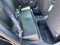 Interior view of the back seat of a 2019 Dodge Charger showing the bench seat and seatbelt attachments