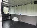 Interior of a 2016 Mercedes-Benz Sprinter van showing a spacious cargo area with plain walls and a flat floor