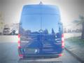 A blue 2017 Mercedes-Benz Sprinter van with a sleek rear design featuring the Mercedes-Benz logo and the word Sprinter prominently displayed