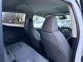 Interior view of a 2019 Chevrolet Colorado showing the back seats and dashboard features