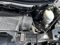 The image shows the engine compartment of a 2013 Chevrolet Express with visible components like the air intake, battery, and fluid reservoirs