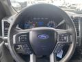 Steering wheel and dashboard of a 2017 Ford F-550 displaying gauges and controls