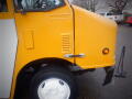 A yellow 2008 Freightliner MT45 Chassis showcasing its distinctive front design and side ventilation system