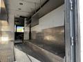 Interior view of a 2017 Freightliner M Line featuring metal checkered flooring and metal shelving along the walls