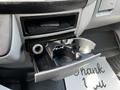 Interior cup holder of a 2017 Mercedes-Benz Sprinter with an open compartment for storage