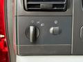 Control panel of a 2007 Ford F-550 featuring knobs for headlights and fog lights