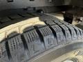 Close-up of a tire from a 2021 Ford Transit showcasing the tread pattern and details of the rubber surface