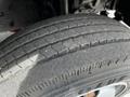 Close-up of a worn tire from a 2018 Hino 195 showing visible tread wear and sidewall details