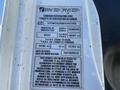 A Canadian certification label for a 2014 International 7400 detailing inspection information and modifications with various identification numbers and specifications