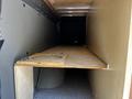 Interior view of a 2017 Mercedes-Benz Sprinter showing a wooden platform and a circular cutout on one side