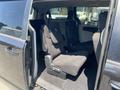 Interior view of a 2020 Dodge Grand Caravan showing two partially folded rear seats in a spacious seating area