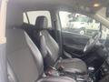 Interior of a 2018 Buick Encore featuring black leather seats and a modern dashboard with a steering wheel and multimedia controls