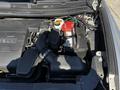 The engine compartment of a 2013 Lincoln MKT showing the engine components battery air intake and various wiring connections