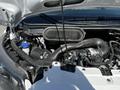 A 2023 Ford Transit engine with visible components including the air intake and various hoses and tubes
