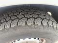 Close-up view of the tread on a tire mounted on a 2009 Dodge Sprinter Van showing detailed patterns and texture of the rubber surface