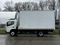 A white 2021 Mitsubishi FE box truck with a large blank cargo area and six wheels displayed from the side