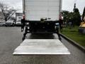 A 2018 Freightliner M2 106 truck with a lowered aluminum liftgate in the rear