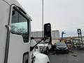 A 2017 Kenworth T370 truck with a prominent side mirror visible in the foreground