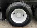 Close-up of a tire mounted on a 2008 International 7500 truck with visible tread pattern and white rim visible