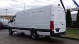 A white 2024 Mercedes-Benz Sprinter 2500 cargo van with a high roof and a sliding side door showing a sleek design and large storage space