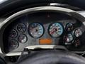 Dashboard of a 2008 International 7500 showing various gauges for speed RPM fuel oil temperature and warning lights