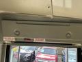 Interior view of a 2018 Chevrolet Express showing the ceiling and control panel with emergency door release instructions