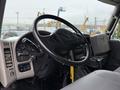 Interior view of a 2012 International TerraStar truck showing the steering wheel dashboard and gear lever