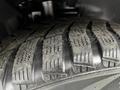 Close-up of a tire with a tread pattern on a 2016 Ford Transit Connect showcasing detailed grooves and surface texture