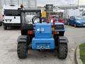 A blue and black 2020 Genie GTH-5519 telehandler with large tires and a raised boom arm showcasing its lifting capabilities