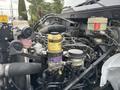 Close-up of the engine compartment of a 2017 Hino 338 showing various components including hoses filters and tanks