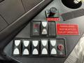 Control panel of a 2017 Chevrolet Express featuring various buttons and switches for operations including parking brake and lights