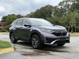 A 2022 Honda CR-V in gray with a sleek design featuring a prominent front grille and stylish alloy wheels parked at an angle
