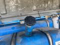 A blue fuel tank cap on a Genie S-65 4X4 aerial lift machine