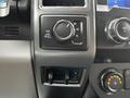 Interior dashboard controls of a 2020 Ford F-350 featuring a control knob for four-wheel drive settings and additional buttons for various functions