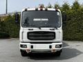 Front view of a 2012 Autocar Xpert with a white exterior featuring large side mirrors and a light bar on top
