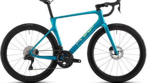 A 2026 Cube Agree C:62 Pro Road Bike featuring a sleek turquoise frame disc brakes and aerodynamic design with black wheels and handlebar