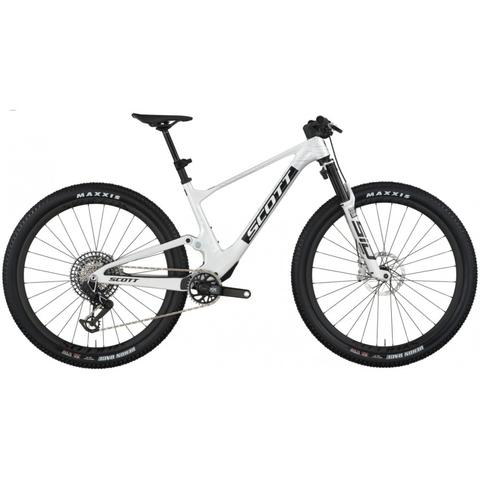 A 2026 Scott Spark RC World Cup EVO Mountain Bike featuring a sleek white frame with black and silver details and equipped with Maxxis tires