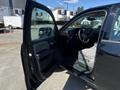 A 2014 GMC Sierra 1500 with the driver's door open showcasing the interior and front seats