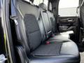 The image shows the black leather rear seats of a 2019 RAM 1500 with a sleek design and contrast stitching