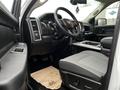 Interior view of a 2022 RAM 1500 Classic showing the driver's seat dashboard and steering wheel with a gray cloth seat and console