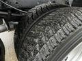 Close-up of a 2012 Ford F-550 tire showing detailed tread pattern and texture