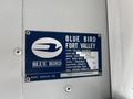 A metal identification plate from a 2022 Blue Bird Vision bus displaying details like the model year, manufacturing date, and capacity information