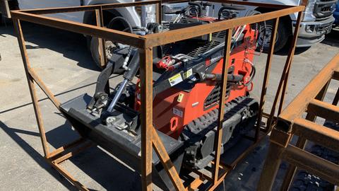 A 2024 AGT LRT23 compact skid steer loader enclosed in a metal frame with wheels and a frontloader attachment