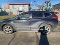 A 2019 Honda CR-V parked with a dirty exterior and alloy wheels