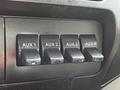 Four toggle switches labeled AUX 1 AUX 2 AUX 3 and AUX 4 on a dashboard panel of a vehicle