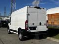 A white 2021 RAM Promaster van with a closed rear and exhaust smoke rising from the back