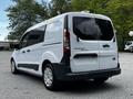 A white 2016 Ford Transit Connect van is shown from the rear with black accents and large tinted windows