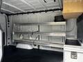 A 2020 Mercedes-Benz Sprinter van interior featuring metal shelving and a storage compartment or drawer on one side